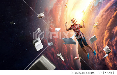 Woman wearing headphones jumping . Mixed media Woman wearing headphones jumping . Mixed media 98162251