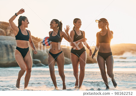 Beach volleyball, women and high five success team by Brazilian ocean, Rio de Janeiro nature sea in summer sunset. Winner sports friends, happy and support in bikini fitness workout or sand exercise Beach volleyball, women and high five success team by Brazilian ocean, Rio de Janeiro nature sea in summer sunset. Winner sports friends, happy and support in bikini fitness workout or sand exercise 98162252