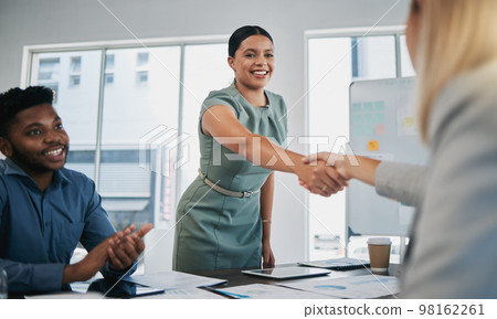 Business people, woman and handshake at meeting, planning and chart on board for target, success or goal. Corporate finance group, applause and celebration for profit, promotion or vision in New York 98162261