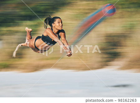 Volleyball, beach sports and fast woman in bikini while on holiday travel in Miami during summer. Jump, cardio and strong girl playing in sport competition by the ocean on vacation for fitness Volleyball, beach sports and fast woman in bikini while on holiday travel in Miami during summer. Jump, cardio and strong girl playing in sport competition by the ocean on vacation for fitness 98162263