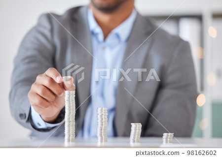 Savings, investment and finance of businessman with money counting wealth, tax or income in office. Money, economy and financial growth of corporate man at desk building coin stack in workplace. Savings, investment and finance of businessman with money counting wealth, tax or income in office. Money, economy and financial growth of corporate man at desk building coin stack in workplace. 98162602