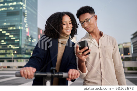 Couple, friends or students in city with phone travel for communication, networking or social media. Electric scooter, happy or black woman and man on smartphone for 5g network, contact us or app Couple, friends or students in city with phone travel for communication, networking or social media. Electric scooter, happy or black woman and man on smartphone for 5g network, contact us or app 98162678