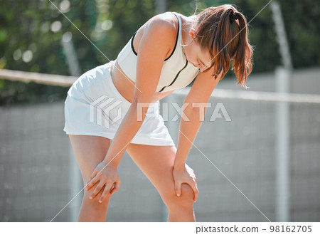 Young woman, athlete and tired on court, training and resting for competition, relax and breathing outdoor. Healthy female, girl and exhausted after match, practice and performance in sportswear. 98162705