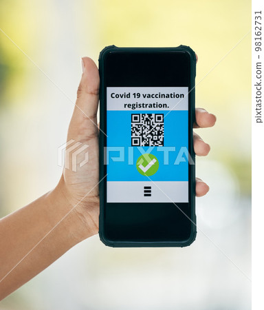 Hand, vaccination and qr code on app on a phone for registration for travel safety or protection. Covid vaccine, barcode and digital certificate on cellphone for healthcare compliance during pandemic Hand, vaccination and qr code on app on a phone for registration for travel safety or protection. Covid vaccine, barcode and digital certificate on cellphone for healthcare compliance during pandemic 98162731