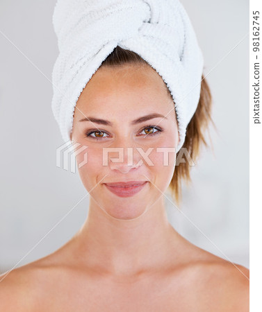 What shall we do first Hair. Head shot of a stunning brunette woman with her hair wrapped up in a towel. 98162745