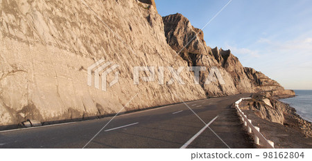 Beautiful journeys. an empty road through the countryside. 98162804