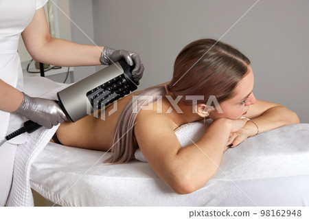 Endosphere therapy of female body by cosmetologist in beauty salon 98162948