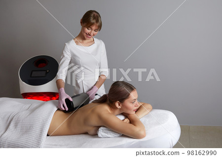 Endosphere therapy of female body by cosmetologist in beauty salon 98162990