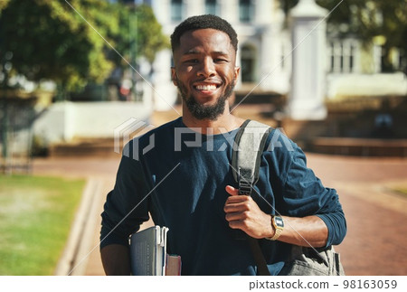 Education, campus and university portrait of student with books, backpack and ready for study, school or learning. Knowledge commitment, scholarship and studying black man happy at college building Education, campus and university portrait of student with books, backpack and ready for study, school or learning. Knowledge commitment, scholarship and studying black man happy at college building 98163059