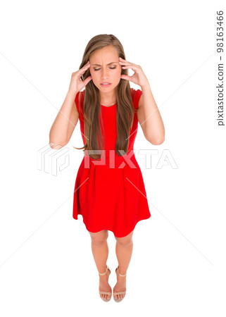 Shes got a massive headache. High angle shot of an attractive young woman posing against a white background. 98163466