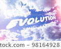 Evolution. Text from clouds in sky in bright sunlight. 98164928