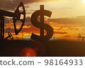 Sing ruble and oil sign against backdrop of beautiful sunset.  98164933