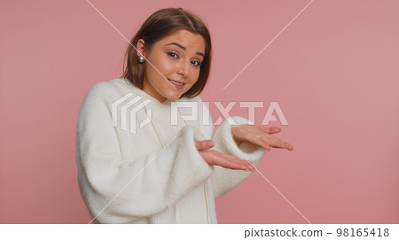 Woman raising hands asking what why reason of failure demonstrating disbelief irritation by troubles 98165418