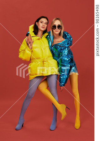 Two pretty girls in puffs posing for the camera in the studio 98165498