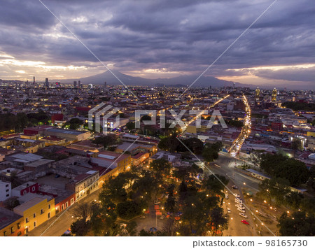 Puebla at Dramatic evening Sunset aerial drone shot of City Center in Puebla de Zaragoza, Puebla State, Mexico Puebla at Dramatic evening Sunset aerial drone shot of City Center in Puebla de Zaragoza, Puebla State, Mexico 98165730