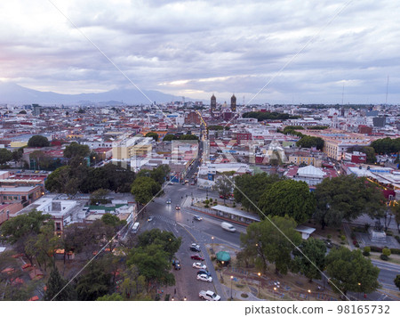 Puebla at Dramatic evening Sunset aerial drone shot of City Center in Puebla de Zaragoza, Puebla State, Mexico Puebla at Dramatic evening Sunset aerial drone shot of City Center in Puebla de Zaragoza, Puebla State, Mexico 98165732