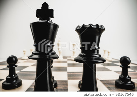 Macro photo of chess pieces on a chess board 98167546