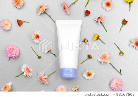 Skin care cosmetics tube on floral background Skin care cosmetics tube on floral background 98167602