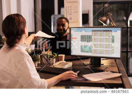 Woman analyzing fund market investment revenue in coworking space, broker looking at global stock exchange statistics on computer screen. Financial analytics analysis, company income diagram 98167981
