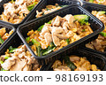 Thai food lunch boxs,  Thai Stir-fried Rice Noodles with Black Soy Sauce and Pork (Pad See Ew) in take away plastic box. 98169193