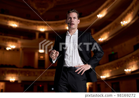 Showman. Middle Age Male entertainer, presenter or actor on stage. male public speaker 98169272