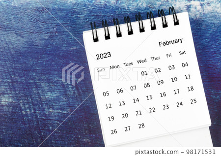 The February 2023 Monthly desk calendar for 2023 year on old blue wooden background. The February 2023 Monthly desk calendar for 2023 year on old blue wooden background. 98171531