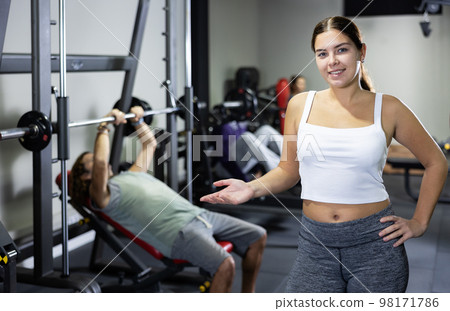 Portrait of slim woman smiling after work out in gym 98171786