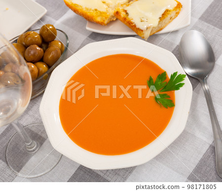 Spanish dish Gazpacho, made from tomato puree, is served with croutons Spanish dish Gazpacho, made from tomato puree, is served with croutons 98171805