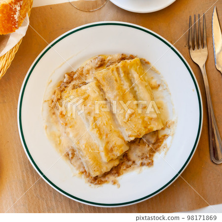 Portion of cannelloni served on table in restaurant Portion of cannelloni served on table in restaurant 98171869