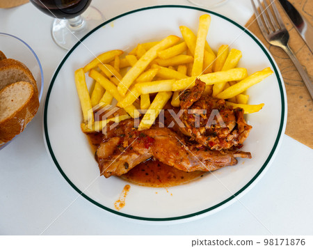 Dish of stewed rabbit and potatoes Dish of stewed rabbit and potatoes 98171876