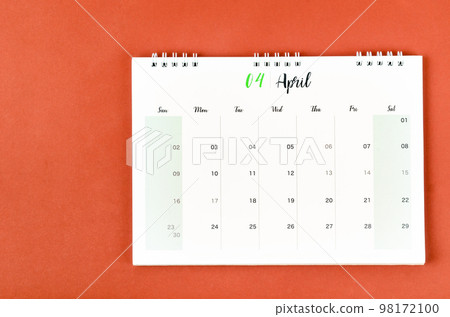 The April 2023 calendar desk for the organizer to plan and reminder on red background. The April 2023 calendar desk for the organizer to plan and reminder on red background. 98172100