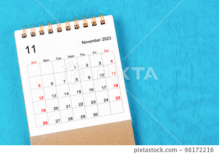 The November 2023 Monthly desk calendar for 2023 year on blue background. The November 2023 Monthly desk calendar for 2023 year on blue background. 98172216