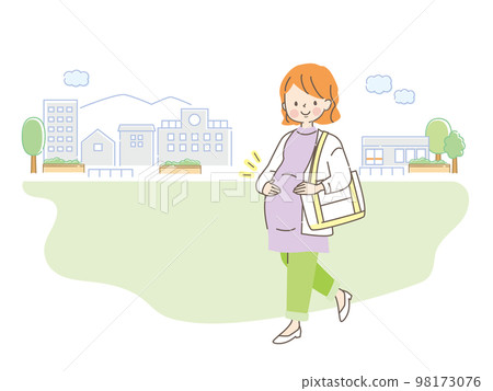 A smiling pregnant woman walking in the city 98173076