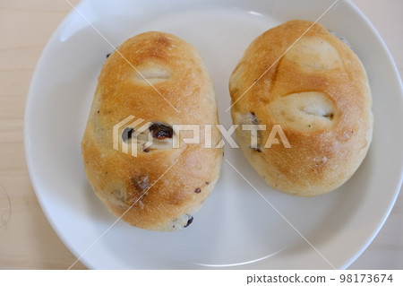 Homemade raisin roll with lots of grapes (taken from directly above) Homemade raisin roll with lots of grapes (taken from directly above) 98173674