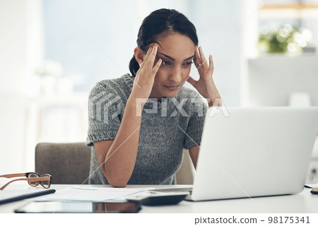 Confused, stressed and anxious businesswoman with laptop suffering from a headache, pressure and agency deadline. Creative entrepreneur thinking of solution, making mistake and trying to understand Confused, stressed and anxious businesswoman with laptop suffering from a headache, pressure and agency deadline. Creative entrepreneur thinking of solution, making mistake and trying to understand 98175341