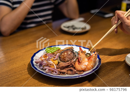 eat plate of seafood on table eat plate of seafood on table 98175796