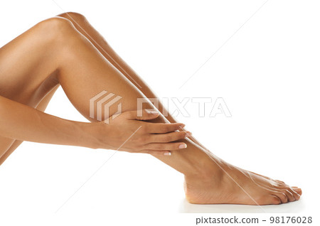 Skin, legs and woman in studio for beauty, wellness and grooming against a white background. Skincare, leg and model feeling perfect, smooth and glowing, satisfaction and luxury routine for body care 98176028