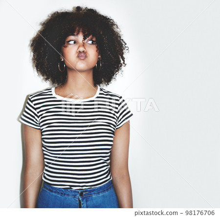 Young black woman, funny face and playful with lips pout, comic, crazy and gen z youth with studio background. Comedy, goofy and silly facial expression, fashion and trendy with body language mock up Young black woman, funny face and playful with lips pout, comic, crazy and gen z youth with studio background. Comedy, goofy and silly facial expression, fashion and trendy with body language mock up 98176706