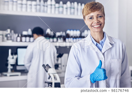 Science, thumbs up and research, portrait of woman pharmacist or healthcare scientist in laboratory. Medical innovation, analytics and success, happy woman pharmaceutical medicine employee with smile 98176746