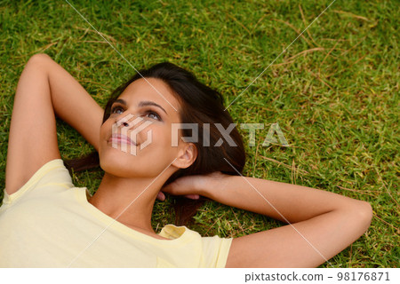Black woman, grass and freedom while thinking in nature about free time to relax and find peace at a calm park. Happy young model outdoor in a garden for happiness, mental health and wellness Black woman, grass and freedom while thinking in nature about free time to relax and find peace at a calm park. Happy young model outdoor in a garden for happiness, mental health and wellness 98176871
