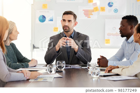 Business meeting, finance strategy and corporate man speaker with an office team talking and planning. Teamwork, working and company communication of a discussion about financial data and information Business meeting, finance strategy and corporate man speaker with an office team talking and planning. Teamwork, working and company communication of a discussion about financial data and information 98177249