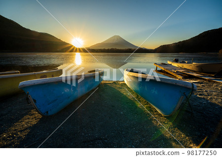 Boat and Mount Fuji from Lake Shoji at sunrise Boat and Mount Fuji from Lake Shoji at sunrise 98177250