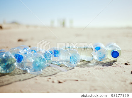 Plastic bottles, beach sand or litter in recycling volunteering, global warming sustainability or earth community service. Zoom, trash texture or ocean waste management in environment nature cleaning 98177559