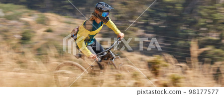 Speed cycling, mountain bike and man travel on nature path for outdoor exercise, training workout or marathon race. Freedom, sports adventure and bicycle cyclist on fast journey for fitness workout 98177577