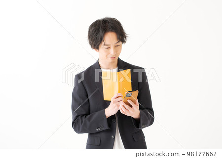 A man in his twenties in a jacket A man in his twenties in a jacket 98177662