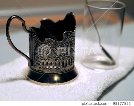 Metal coaster as a retoro relic of the Russian railway. Use the services on the road. Metal coaster as a retoro relic of the Russian railway. Use the services on the road. 98177835