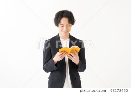 A man in his twenties in a jacket 98178460