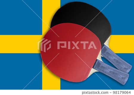 Two tennis rackets on the background of the flags of Sweden Two tennis rackets on the background of the flags of Sweden 98179064
