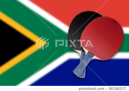 Two tennis rackets on the background of the flags South Africa 98180257