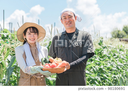 Asian men and women who do agriculture, farmers, and home gardens (vegetables) 98180691